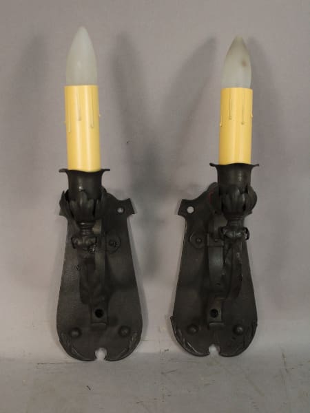Wall sconces with yellow candle lights.
