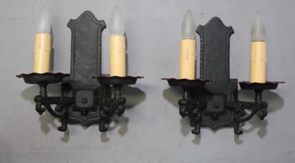 Wall-mounted candle holders with faux flames.