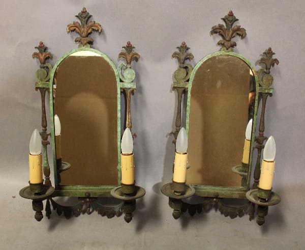 Vintage mirrors with candle holders, ornate design.