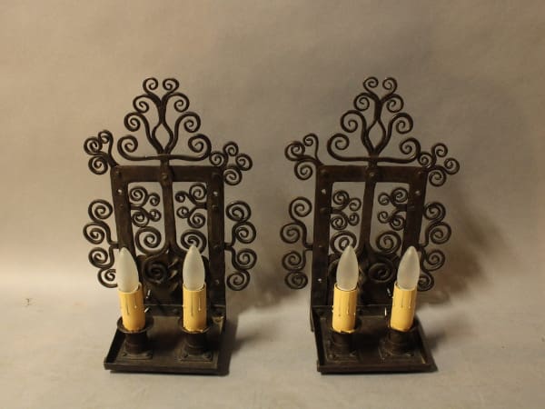 Pair of decorative candle holders with lights.