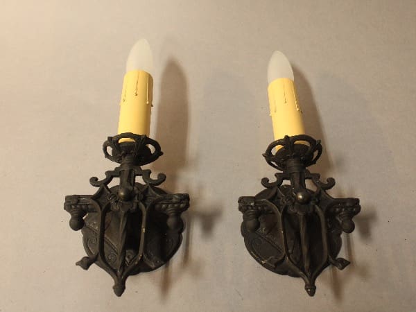 Wall sconces with yellow candle-style lights.