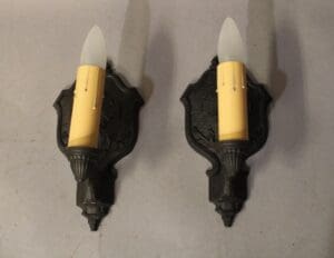 Pair of vintage wall sconces with candles.