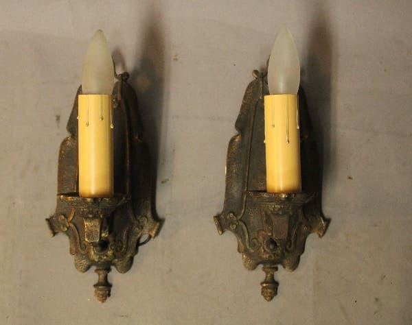 Vintage wall sconces with candle-like bulbs.