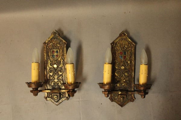 Vintage wall sconces with decorative details.