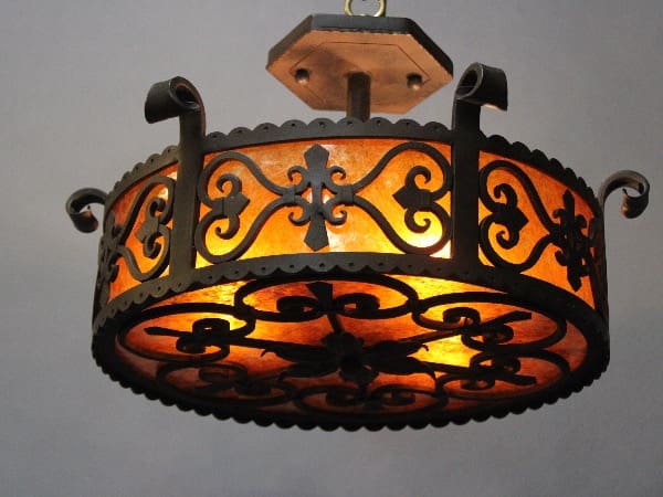 Ornate chandelier with warm orange glow.