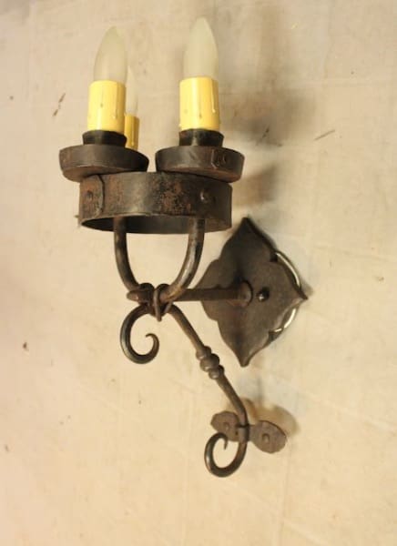Vintage wall sconce with two light bulbs.