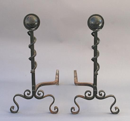 2583. Pair of Iron Andirons with spiral designs and globular tops on a neutral background.