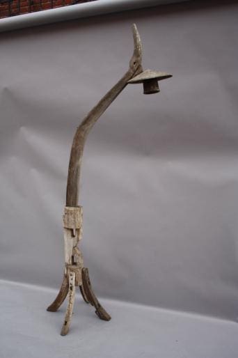 Rustic wooden lamp with unique design.