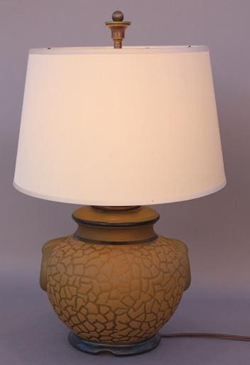 6223. Vintage 1930's Glass Table Lamp with a textured brown base and a white lampshade, illuminated, against a plain background.