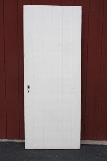 White door against a red background.