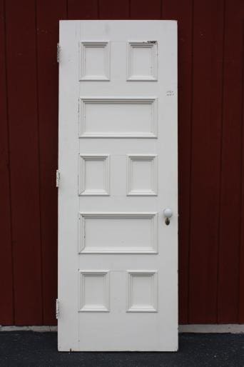 White door against a red background.