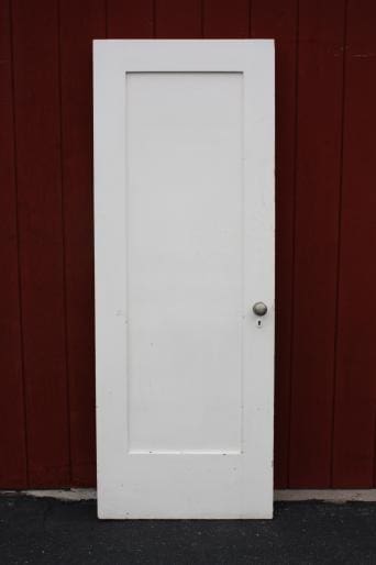 White door against a red background.