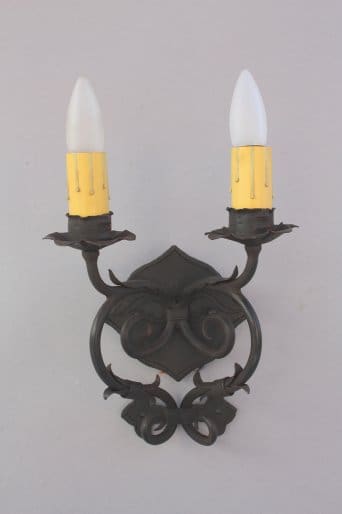 Wall-mounted black sconce with two lights.