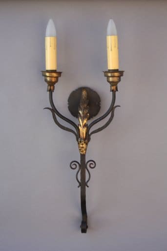 Vintage wall sconce with two candle lights.