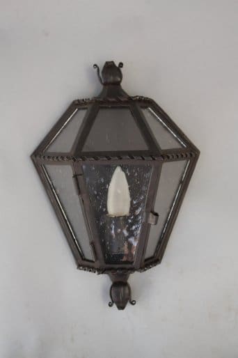 Vintage-style outdoor lantern on wall.
