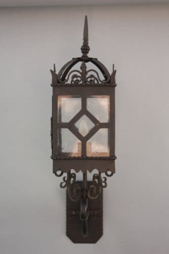 Decorative wall-mounted lantern with intricate design.