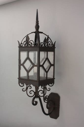 Decorative wall lantern with intricate design.