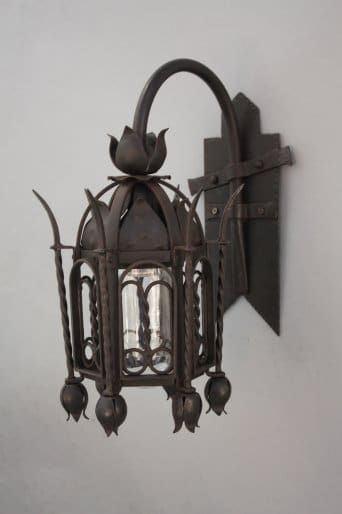 Decorative wall lantern with intricate design.