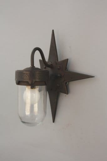 Bronze wall lamp with star-shaped fixture.