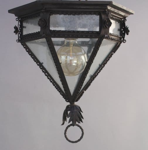 Vintage hanging lantern with glass panels.