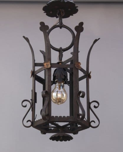 Ornate hanging lantern with decorative metalwork.
