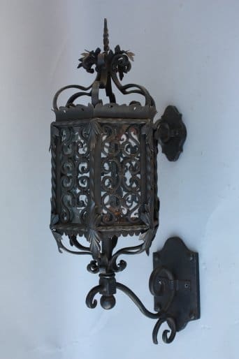 Decorative wall-mounted lantern with intricate design.