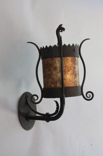 Decorative wall lamp with intricate design.