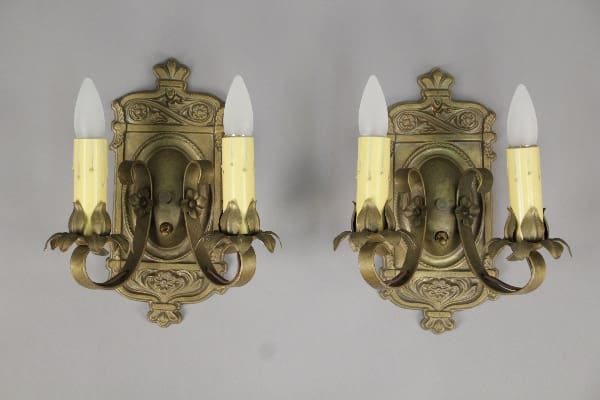 Pair of antique ornate wall sconces with candles