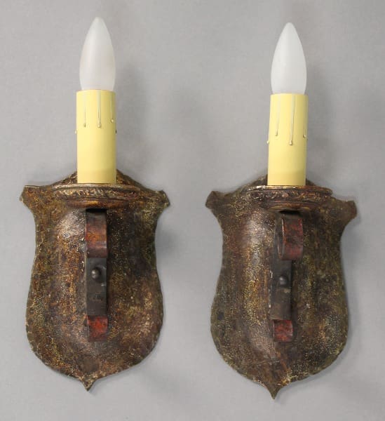 Two vintage wall sconces with bulbs.