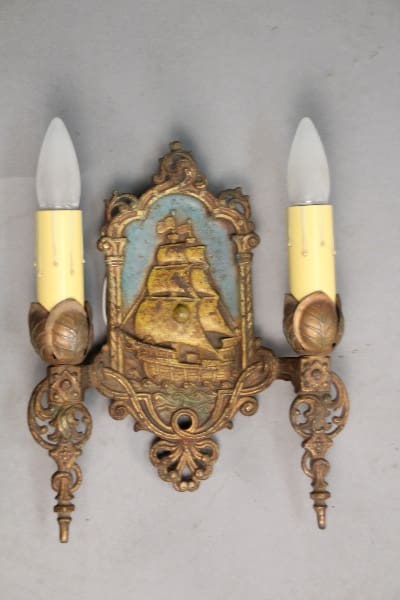 Wall sconce featuring a ship design.