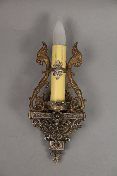 Ornate candle holder with decorative elements.