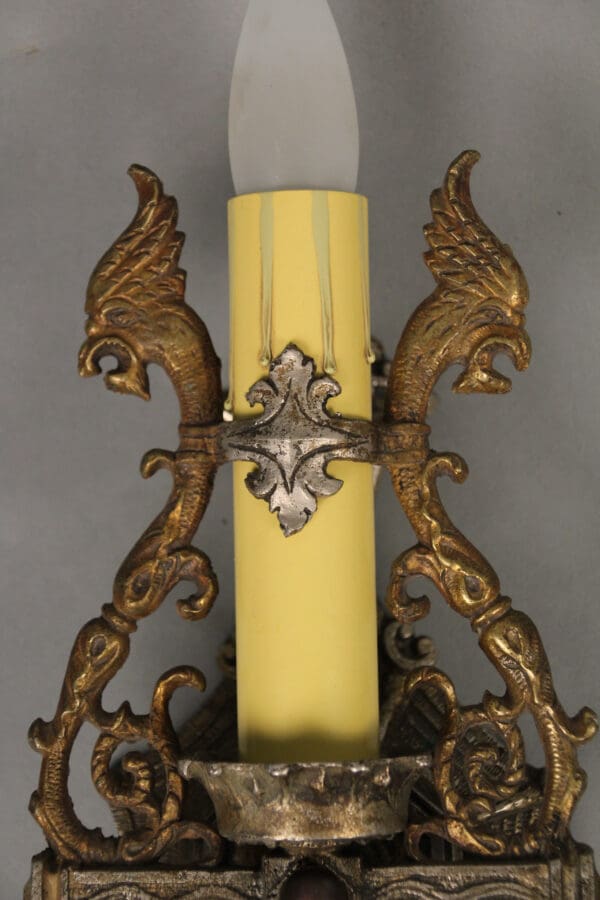 Ornate candle holder with decorative accents.