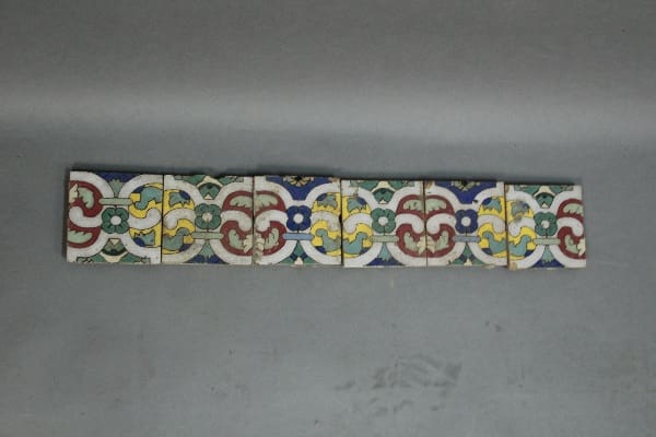 Row of colorful patterned tiles.