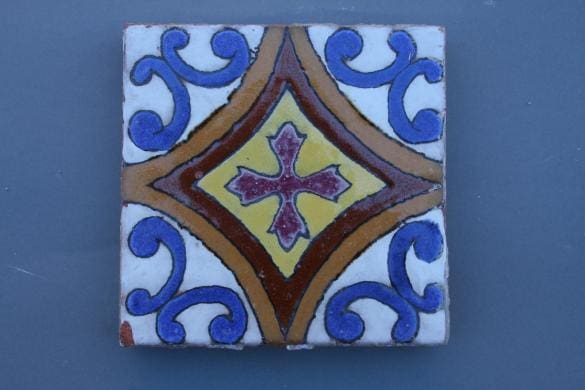 Colorful tile with a cross design.