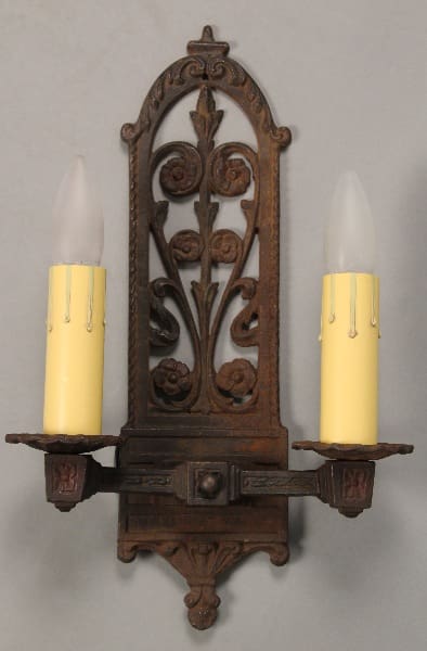 Vintage wall sconce with two candleholders.