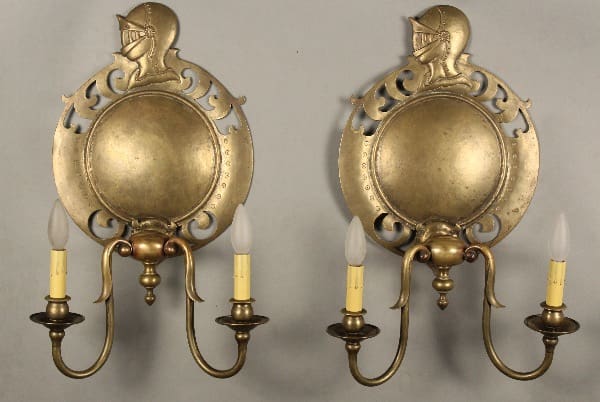 Brass wall sconces with knight motifs.
