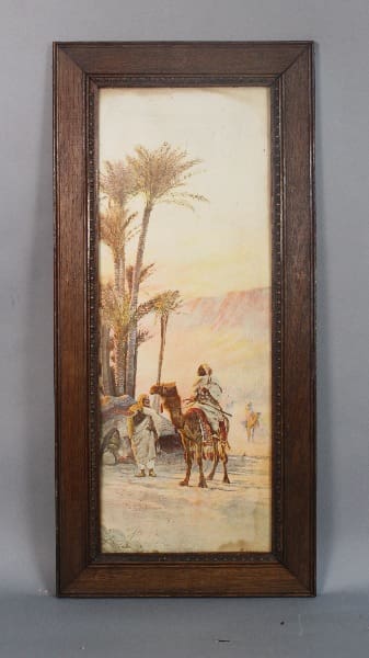 Framed painting of a camel caravan in a desert.