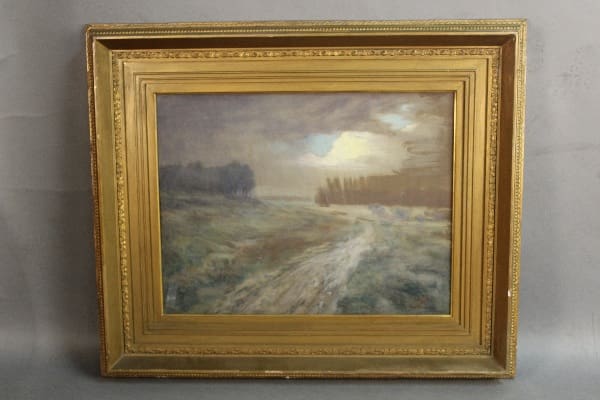 Framed landscape painting with a path.