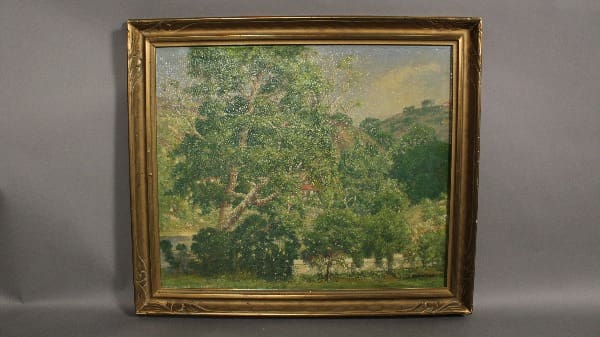 Framed painting of a landscape with trees.