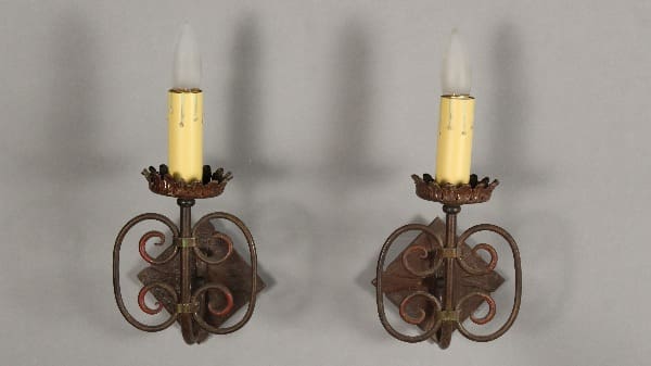 Vintage wall sconces with candle-like lights.
