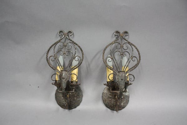 Decorative wall sconces with deer motifs.