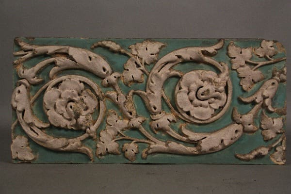 Ornate tile with floral motifs.