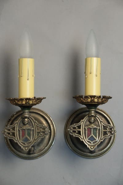 Vintage wall sconces with candle-shaped bulbs.