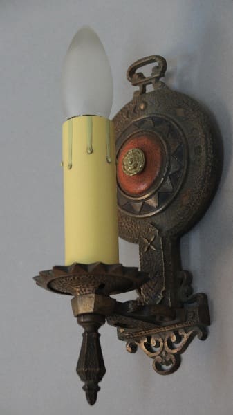 Vintage wall sconce with candle design.