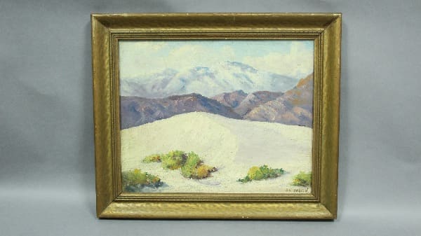 Mountain landscape painting in ornate frame.
