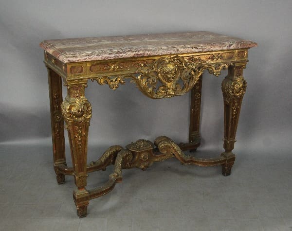 Ornate gilded marble top console table.