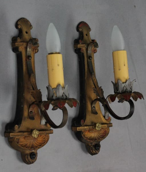 Vintage wall sconces with candle-shaped bulbs.
