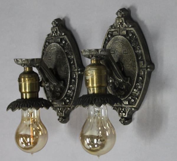 Vintage wall sconces with decorative bulbs.