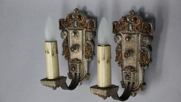 Vintage wall sconces with decorative design.