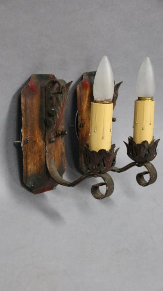 Vintage wall sconce with two candle lights.